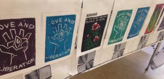 Prints that read "Love and Liberation."
